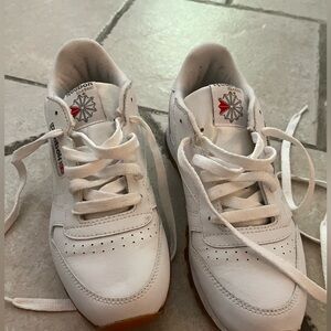 White Reebok shoe. White. Size 6 female, 3 1/2 male
